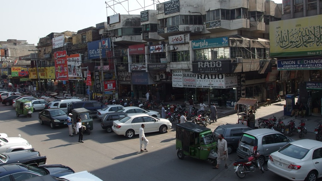 Traffic and colonial-era buildings on The Mall in central Lahore