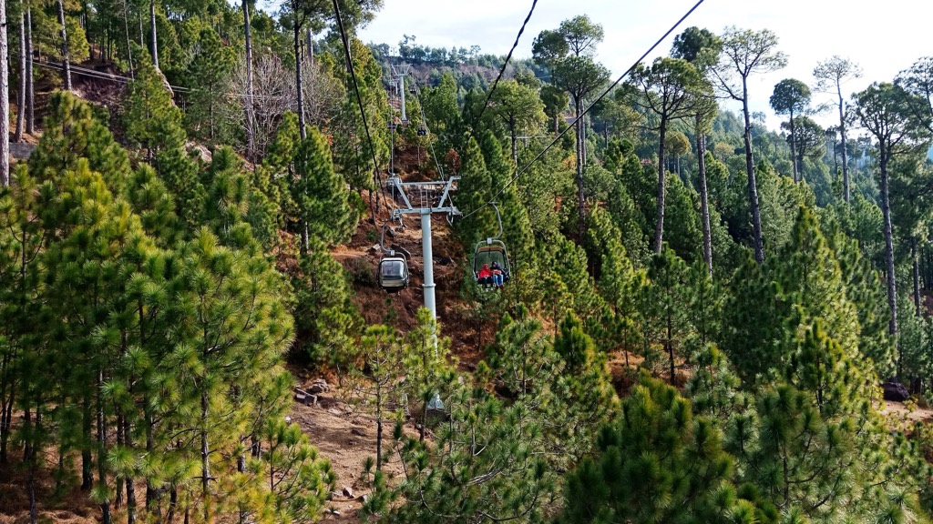 Chairlift cabins above the forest at Patriata near Murree
